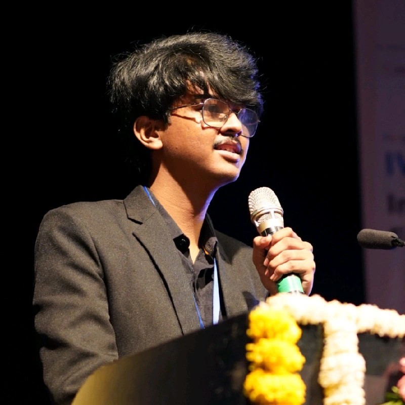 Professional headshot of Gaus Mohiuddin Sayyad with a robotics-themed background